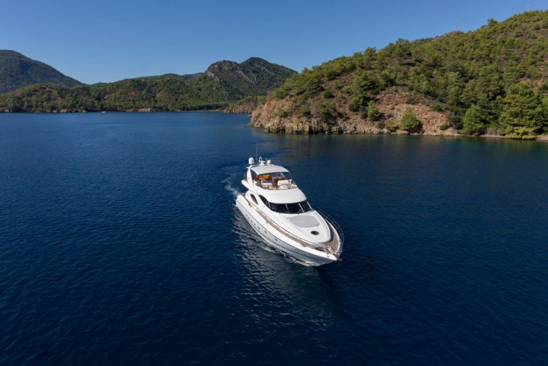 Luxury motor yacht underway in a Mediterranean bay